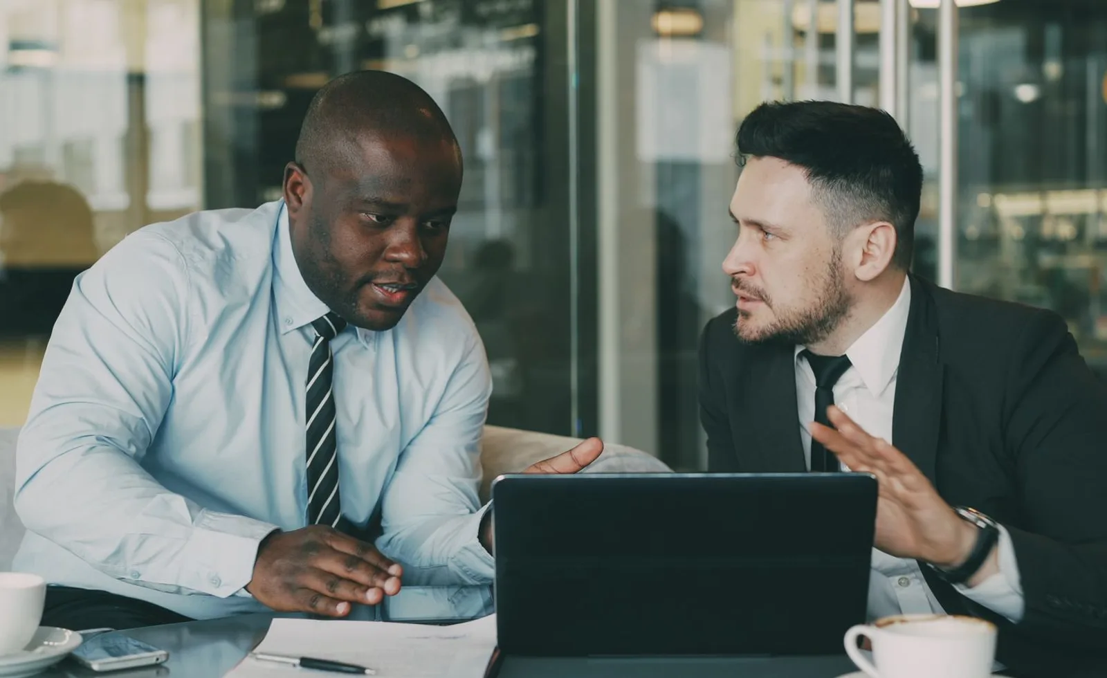 Business professionals discussing growth priorities during a consultation